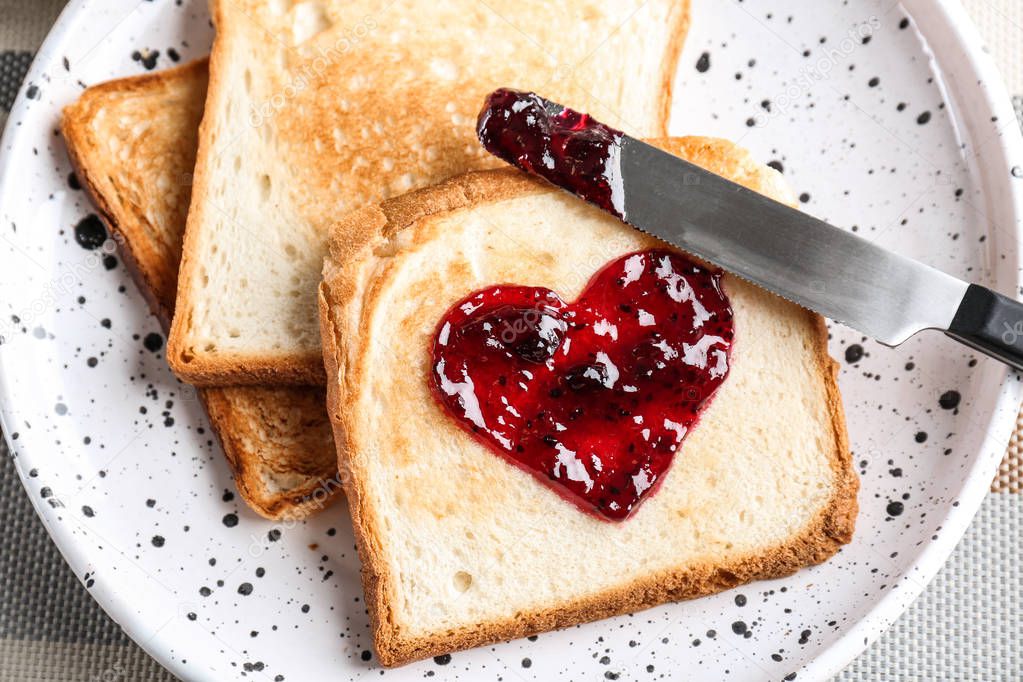 Delicious toast with sweet jam on plate