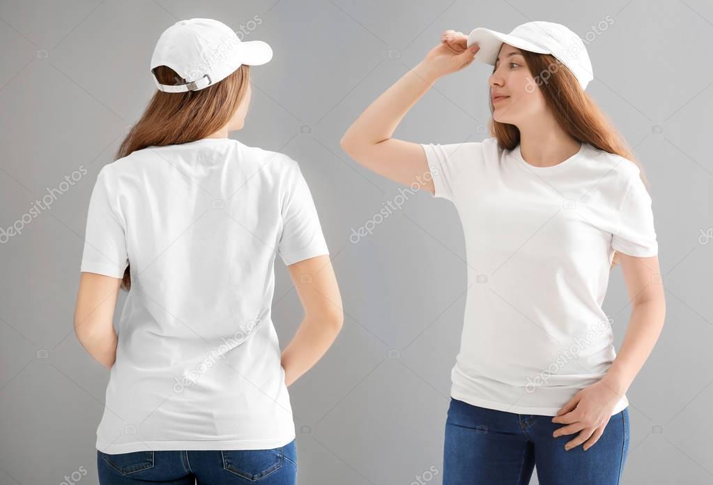 Front and back views of young woman in stylish t-shirt and cap on grey background. Mockup for design