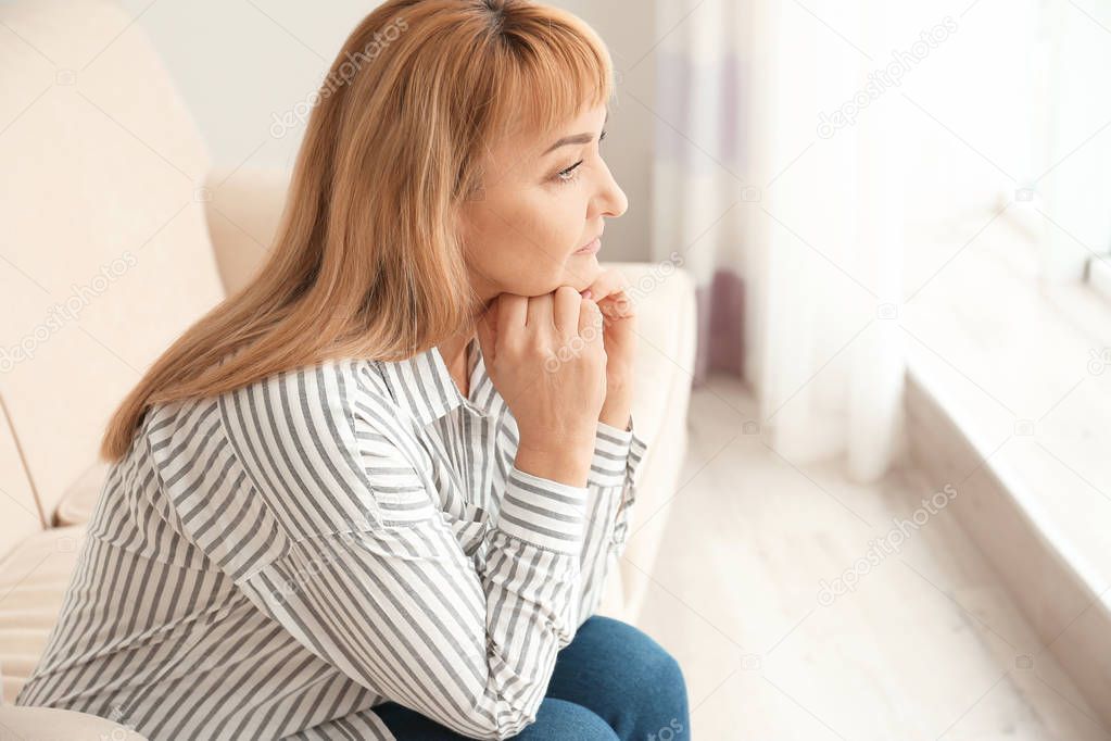 Senior woman in casual clothes at home