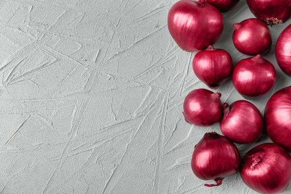 Red onion on light background — Stock Photo, Image