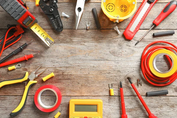 Different electrical tools on wooden background — Stock Photo, Image
