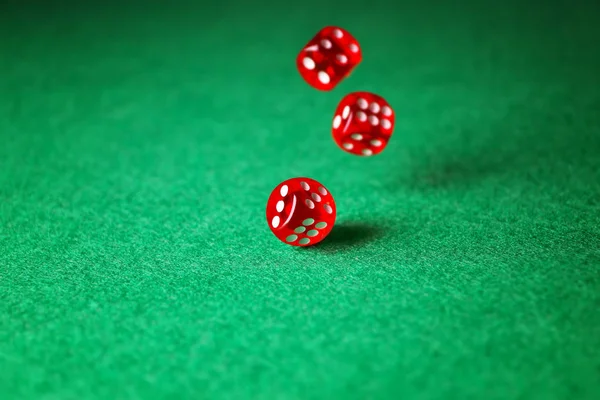 Dices on green table in casino