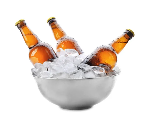 Bowl with bottles of beer in ice on white background — Stock Photo, Image