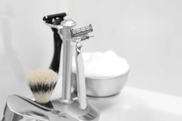 Shaving accessories for man on sink — Stock Photo, Image