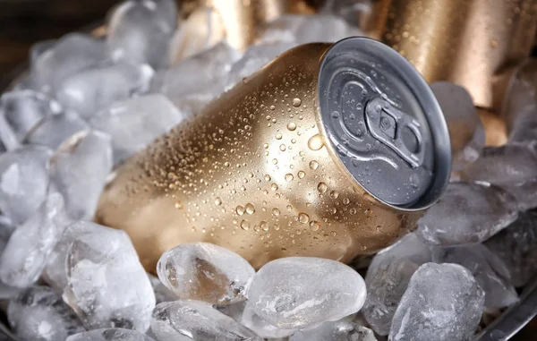 Cans of beer in ice, closeup