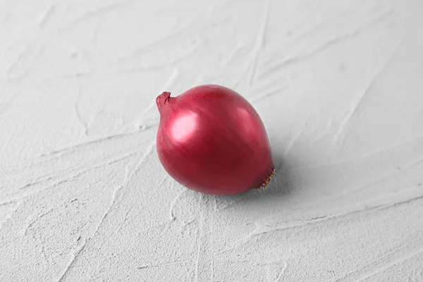 Red onion on light background — Stock Photo, Image