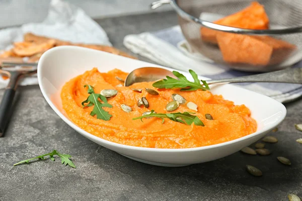 Plate with tasty mashed sweet potato on table — Stock Photo, Image