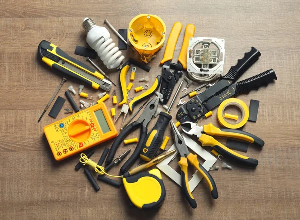 Different electrical tools on wooden background — Stock Photo, Image