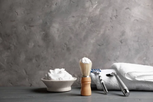 Shaving accessories for man on table against grey background — Stock Photo, Image