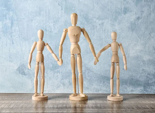 Wooden people holding hands together on table. Unity concept — Stock Photo, Image