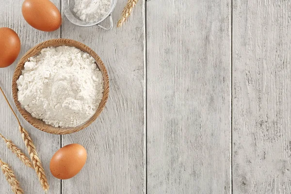 Composition with wheat flour on wooden background, top view — Stock Photo, Image