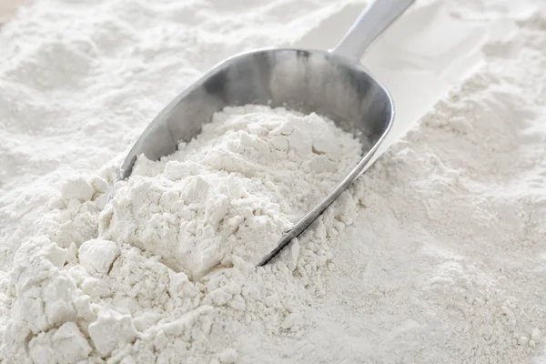 Scoop on flour, closeup — Stock Photo, Image