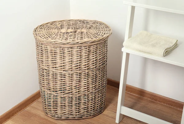 Laundry basket on floor in room — Stock Photo, Image