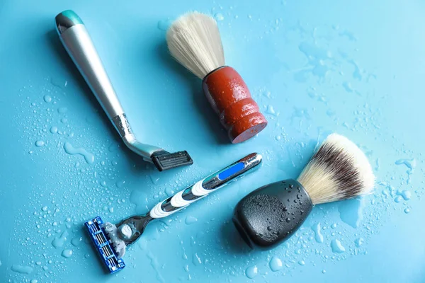 Shaving brushes and razors for man on color background — Stock Photo, Image
