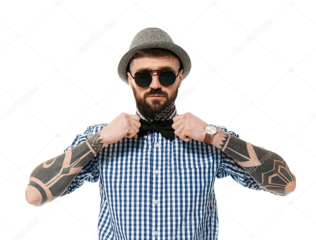 Portrait of handsome hipster in stylish outfit on white background