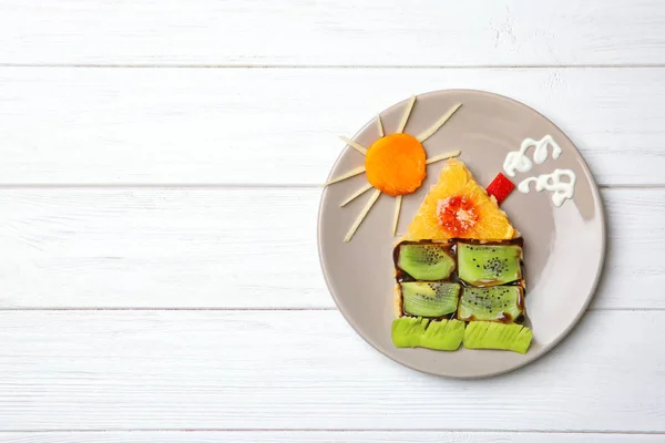 Funny food idea for kid breakfast on wooden background — Stock Photo, Image