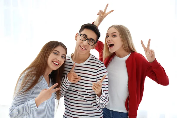 Young smiling people on white background
