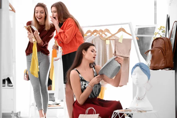 Young beautiful women shopping in store — Stock Photo, Image