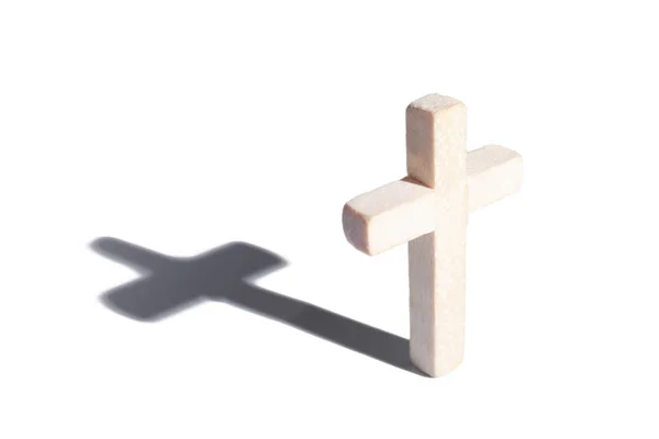 Wooden cross with shadow on white background — Stock Photo, Image