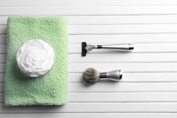 Barber brush, shaving foam and razor for man on wooden background — Stock Photo, Image