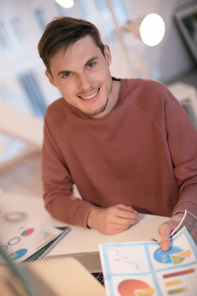 Young man working with documents indoors — Stock Photo, Image