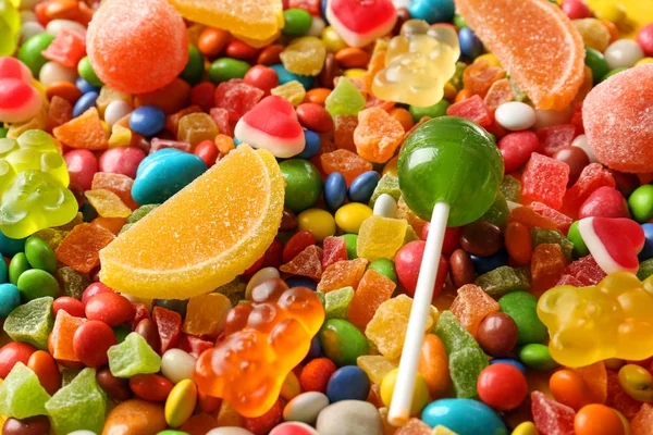 Różne kolorowe cukierki, jako tło — Zdjęcie stockowe