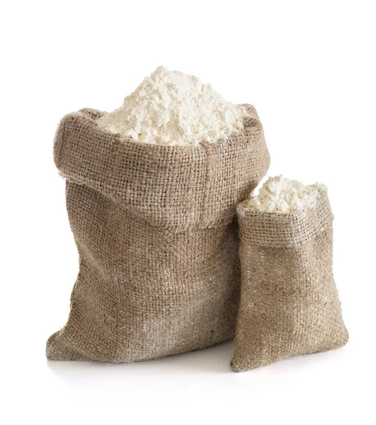 Bolsas con harina sobre fondo blanco — Foto de Stock