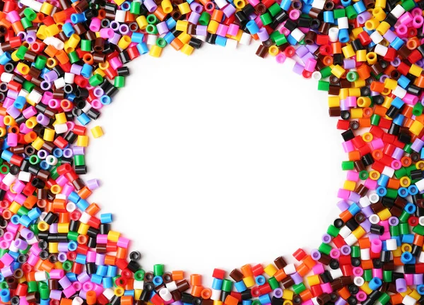 Colorful plastic beads on white background — Stock Photo, Image