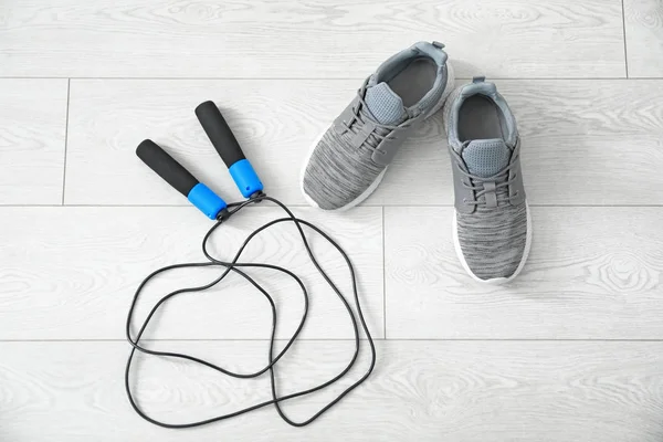 Composition with sport shoes on floor — Stock Photo, Image
