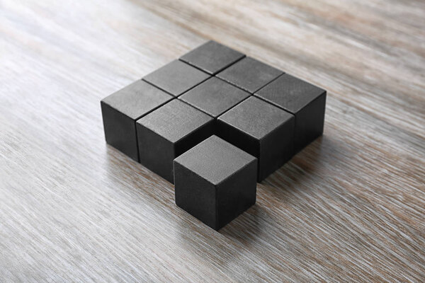 Wooden cubes on table. Unity concept