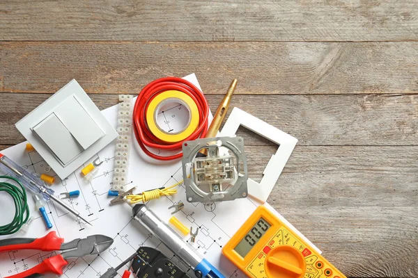 Different electrical tools on wooden background — Stock Photo, Image