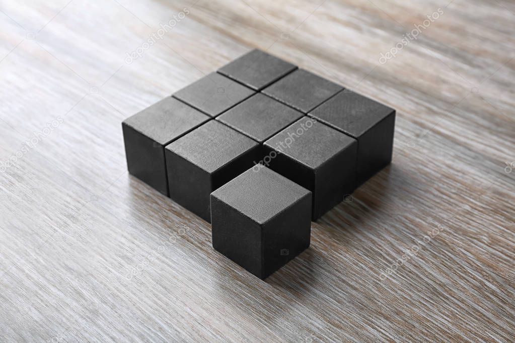 Wooden cubes on table. Unity concept