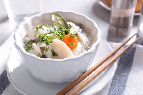 Tasty broth with dumplings — Stock Photo, Image