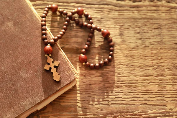 Cross on wooden background — Stock Photo, Image