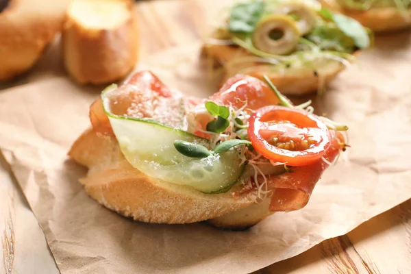 Delicious bruschetta with prosciutto — Stock Photo, Image