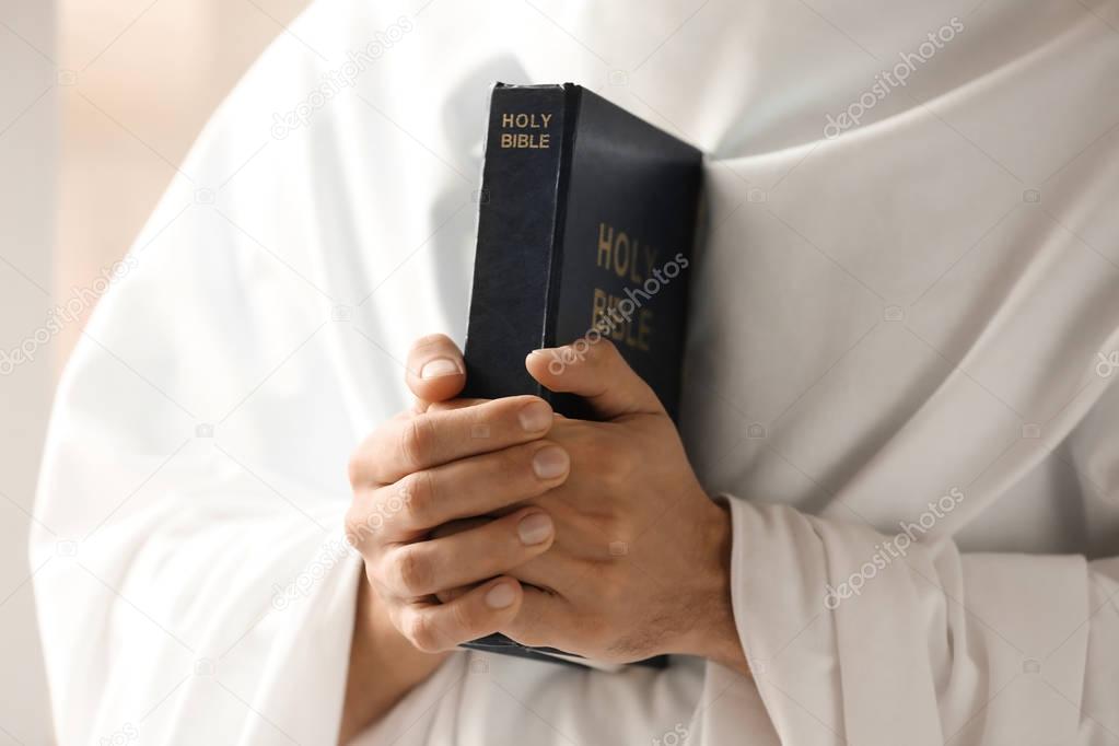 Young monk with Bible