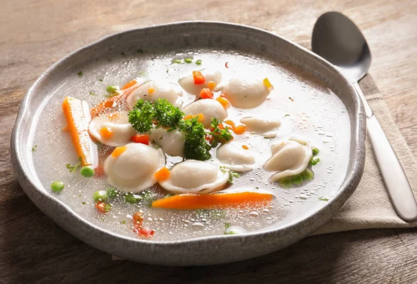 Tasty broth with dumplings — Stock Photo, Image