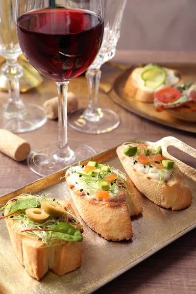 Delicious bruschettas on wooden table — Stock Photo, Image