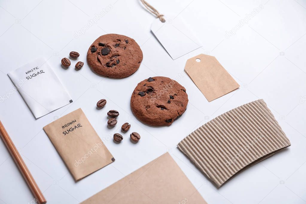 Composition with sugar packages and tags as mockups for branding on white background