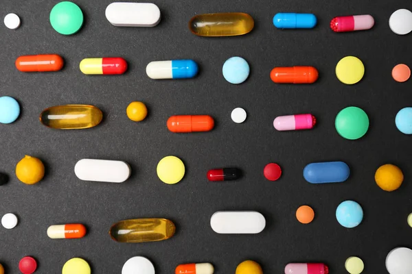 Many different pills on black background — Stock Photo, Image