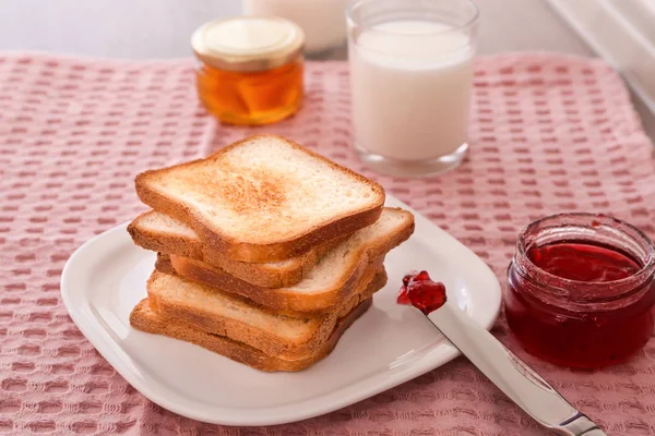 Plate with toasted bread and jam on table — Stock Photo, Image