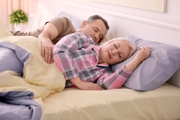 Senior couple in bed together at home — Stock Photo, Image