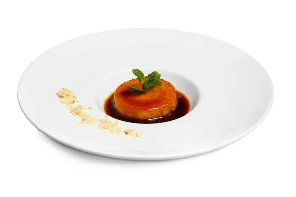 Plate with delicious flan on white background — Stock Photo, Image