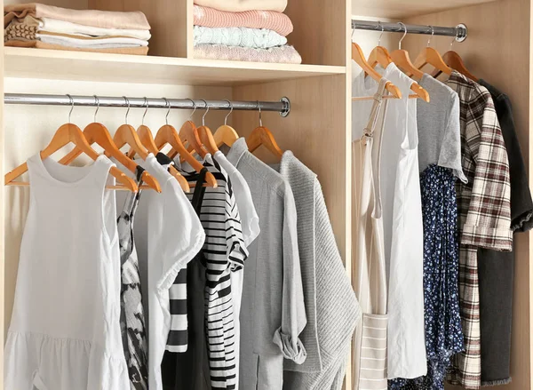 Large wardrobe closet with different clothes