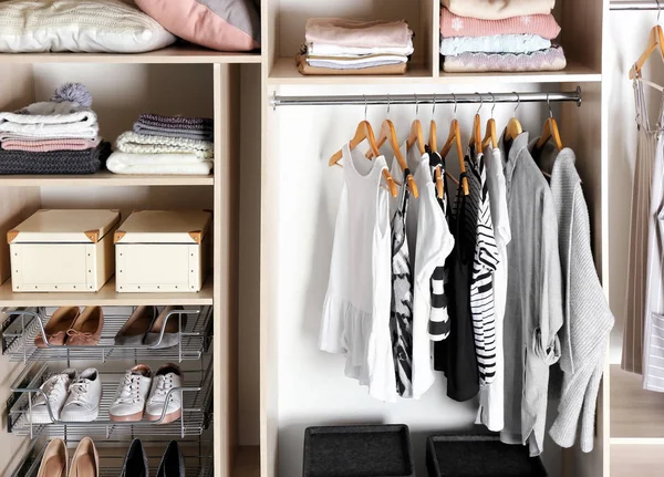 Large wardrobe closet with different clothes, home stuff and shoes — Stock Photo, Image