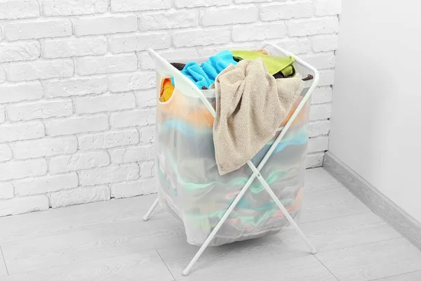 Laundry basket with dirty clothes indoors — Stock Photo, Image