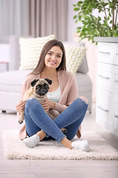 Woman with cute dog at home. Friendship between pet and owner — Stock Photo, Image