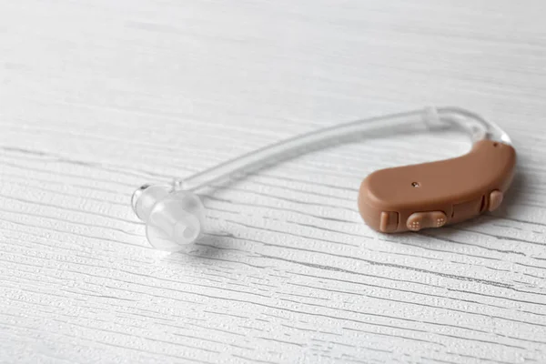 Hearing aid on light background — Stock Photo, Image