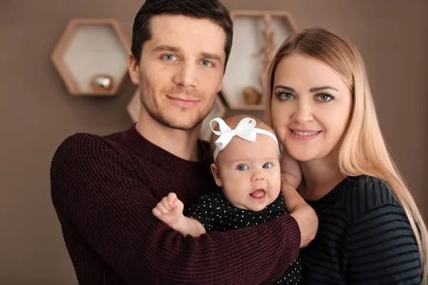 Young parents with baby at home — Stock Photo, Image