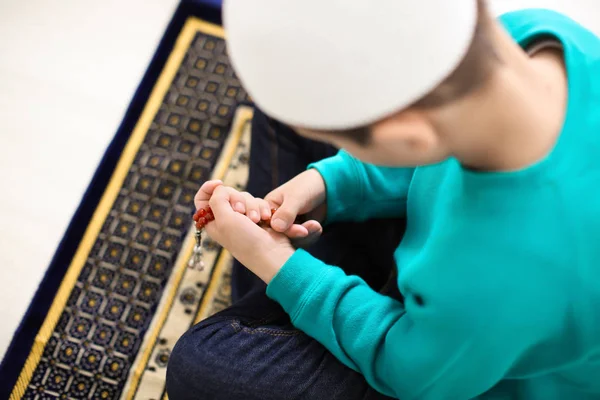 Little Muslim boy praying, indoors — Stock Photo, Image